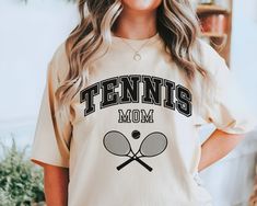 Tennis Mom Shirt, Tennis Mom Gifts, Tennis Mom, Gift for Mom, Mothers Day Shirt, Sports Mom Shirt, Mothers Day Gift T-shirt HOW TO ORDER 1. Check our photos for sizing and color options. 2. Select your size and color from the drop-down menus. 3. Click "ADD TO CART" to add the shirt to your cart. 4. Click "PROCEED TO CHECKOUT" to purchase your shirt. PRODUCTION TIME: 1-3 days (Usually 2 days) SHIPPING TIME: United States - Economy: 4 - 8 business days - Standard: 2 - 5 business days Rest Of World Tennis Mom Shirts Designs, Sporty Crew Neck T-shirt For Mother's Day, White Sporty T-shirt For Mother's Day, Sporty White T-shirt For Mother's Day, Tennis Mom, Sports Mom Shirts, Sports Mom, Mom Gifts, Mothers Day Shirts