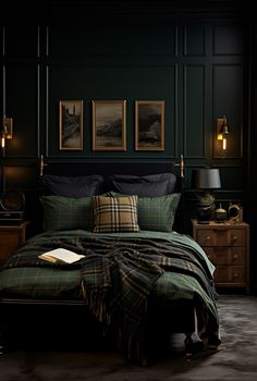 a bedroom with dark green walls and plaid bedspread, black comforter, gold framed pictures on the wall