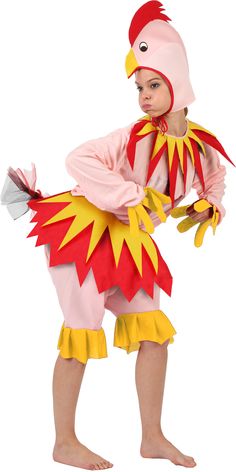 a little boy dressed up in a chicken costume with wings and tail, holding an object