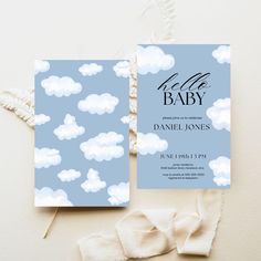 a baby announcement card with clouds on it