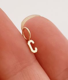 "Gold Initial 14k charm, designed for a delicate or minimalist style you. Matching with all styles. Add a personalized touch to any pendant/necklace or a bracelet. Initial comes as loop soldered. ( I have other style as a sideways available in my shop) feel free to check it out. ♥Quick tip: If you are size XS,S, go for 14'' -15'' chain. If you are (S-M), M ,L go with 16''-18\".♥ This are tips I have learned by talking to my customers and getting a feedback! Letter charm is a perfect gift for: An Number Jewelry, 14k Gold Initial Necklace, Letter Charm Necklace, Charm Choker Necklace, Dainty Initial Necklace, Letter Gifts, Family Necklace, Solid Gold Necklace, Initial Necklace Gold