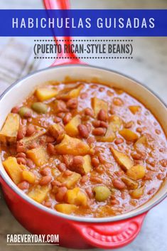 a red pot filled with beans and potatoes