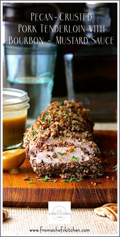 pork tenderion with bourbon mustard sauce on a cutting board