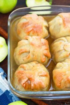 apples and cinnamon rolls in a glass baking dish