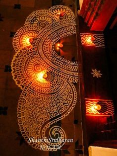 an intricately designed table with candles on it