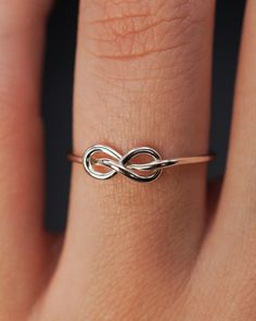 The Infinity Knot Ring is really cute and easy to wear on a daily basis! The infinity knot detail adds a bit of extra interest to a classic hammered stacking ring. This ring is a great alternative to a stacking ring and it looks beautiful combined with other stacking sets. This ring makes a lovely alternative engagemen Infinity Knot Ring, Promise Rings Simple, Space Rings, Friendship Ring, Pretty Jewelry Necklaces, Alternative Engagement Ring, Infinity Knot, Celtic Knot Ring, Single Ring