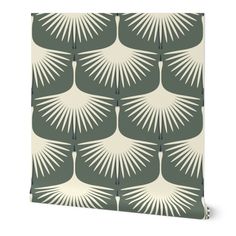 a green and white wallpaper with an abstract design on the front, featuring palm leaves