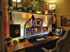 a desk with a computer and speakers on it