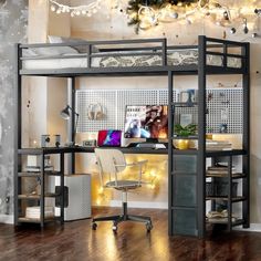 a loft bed with desk underneath it and christmas lights hanging from the ceiling over it