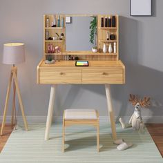 a wooden desk with a mirror and stool