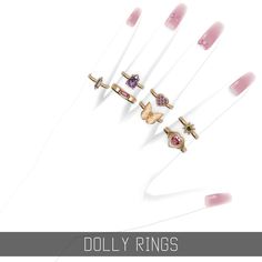 five rings with different designs on them and the words dolly rings written in white letters