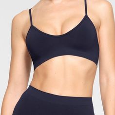 Brand New With Tags. Skims Soft Smoothing Seamless Bralette. Navy Seamless Push-up Yoga Bra, Blue Seamless Elastane Sports Bra, Seamless Workout Bra With Spaghetti Straps, Workout Seamless Bra With Spaghetti Straps, Seamless Stretch Triangle Top Sports Bra, Seamless Stretch Sports Bra With Triangle Top, Seamless Triangle Top Bra For Yoga, Seamless Triangle Top Yoga Bra, Blue Micro-elastic Sports Bra With Seamless Detail