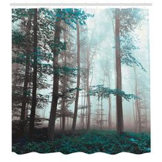 a shower curtain with trees in the fog