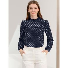 This charming blouse is sure to turn heads with its playful polka-dot pattern and frilly flouncy ruffle trim. The delicate design features a ruffle neck, ruffle decor, long sleeves, and a back bow tie for a touch of elegance. Whether paired with a skirt or skinny pants, this blouse is perfect for any occasion. You'll love the unique feeling of coziness it provides, and its stylish look makes it a versatile addition to your wardrobe. Polka Dot Ruffled Blouse For Work, Polka Dot Ruffle Blouse For Work, Polka Dots Blouse, Long Sleeve Chiffon Shirt, Eyelet Blouse, Delicate Design, Chiffon Long Sleeve, Ruffle Collar, Polka Dot Blouse