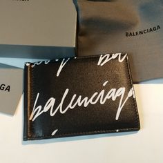 Nwot Balenciaga Cardholder/Wallet Black And White Comes With Box And Dust Bag Designer Bifold Card Holder For Daily Use, Designer Rectangular Card Holder With Logo, Designer Black Bifold Card Holder, Designer Card Holder For Everyday Use, Designer White Rectangular Wallet, Designer White Wallets For Formal Occasions, Leather Card Holder Wallet, Balenciaga Leather, Leather Lanyard