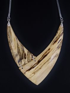 The necklace is one of a kind, handmade from Hackberry wood and has very smooth and brilliant surface. Stainless steel mesh chain 26 inch. Closure Lobster claw Care instructions: Avoid direct contact with perfumes, alcohol, water and other solvents that may damage wood finish. Wipe jewelry with soft dry cloth. Handmade Natural Wood Pendant Jewelry, Unique Wooden Necklace For Gift, Unique Natural Wood Pendant Jewelry, Artisan Natural Wood Pendant Necklace, Unique Handmade Natural Wood Jewelry, Unique Natural Wood Jewelry, Nature-inspired Wooden Pendant Jewelry, Artisan Natural Wood Necklaces, Elegant Natural Wood Jewelry For Gift