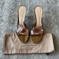 Gianvito Rossi Gold Plexi Sandals Brand New, Shoe Bag And Heel Replacements Included Size 36.5, 3.3 Inch Heel Must Have Mule Style Sandal Box Got Wet In Transit Luxury Formal Sandals With Wedge Heel, Luxury Party Sandals With Wedge Heel, Luxury Leather Sole Sandals For Cocktail, Elegant Wedge Heel Sandals With Wrapped Heel, Designer Formal Wedge Heel Sandals, Elegant Sandals With Wrapped Wedge Heel, Designer Open Heel Sandals For Cocktail, Designer Closed Toe Sandals For Cocktail, Designer Leather Sandals For Events