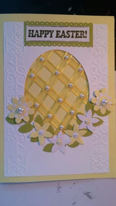 a close up of a greeting card with flowers and an egg on the inside of it