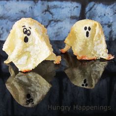 two pieces of food with faces drawn on them