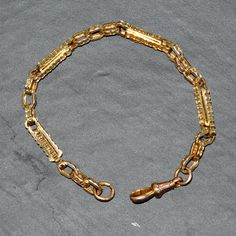 9ct Yellow gold fancy link 'watch chain' bracelet. This chain was part of an antique watch chain, circa 1900. Clasp added in recent years.  Weight   13.5 grams Length of chain 21.5 cm Each and every piece listed by Vintage Fine Jewellery has been restored by hand in our London workshop by highly skilled jewellers. Our jewellers use the same expertise to restore a piece of jewellery, as used in their creation many years ago. If you would like to see more of the Vintage Fine Jewellery Collection, Antique Yellow Gold Link Bracelet, Vintage Yellow Gold Link Bracelets, Vintage 14k Gold Oval Link Bracelets, Engraved Oval Link Yellow Gold Bracelet, Engraved Link Yellow Gold Bracelet, Engraved Yellow Gold Link Bracelet, Engraved Yellow Gold Oval Link Bracelet, Vintage Hallmarked Yellow Gold Chain Bracelet, Vintage Yellow Gold Hallmarked Chain Bracelet