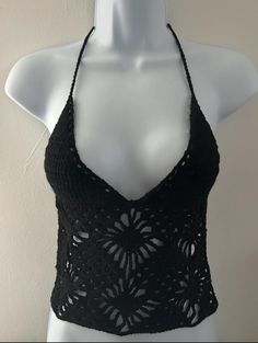 Turn heads with this stunning Backless Crochet Cami Top, the perfect blend of boho chic and modern style. This handcrafted top features intricate crochet patterns that offer a delicate, airy look ideal for warm weather. The elegant backless design adds a daring twist, making it a standout piece for any occasion. Pair it with your favourite high-waisted jeans or a flowing skirt for an effortlessly stylish ensemble. Whether you're heading to a festival, a beach outing, or a casual day out, this ba Bohemian Sleeveless Crochet Dress With Hollow Out, Bohemian Fitted Crochet Dress With Spaghetti Straps, Fitted Bohemian Crochet Dress With Spaghetti Straps, Bohemian Lace Crop Top For Beach, Fitted Crochet Top For Summer Beach Cover-up, Fitted Crochet Top For Beach Cover-up, Lace Crochet Top For Beachwear On Vacation, Summer Lace Crop Top For Vacation, Summer Lace Crop Top For Beach