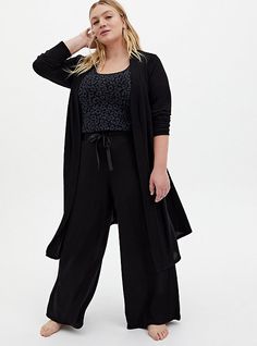 A Super Soft Plush lounge pant with a drawstring waist will have you lounging like a queen.   Matching style(s): Search 14335398, 14335365 Super Soft Plush knit fabric. Stretch drawstring waist. Front pockets. Wide leg. CONTENT + CARE Rayon/polyester/spandex. Wash cold; dry flat. Imported plus size sleepwear. SIZE + FIT Model is 5’10”, size 1. 28. 5” inseam. The best plus size women's super soft plush black wide leg drawstring sleep pant bottoms in deep black made of super soft plush. Lesbian Formal Outfits Plus Size, Plus Size Pajamas For Women, Big Closet, Comfy Pajamas, Wide Leg Lounge Pants, Plus Size Sleepwear, Plus Size Pajamas, Accessory Ideas, Pajamas Comfy