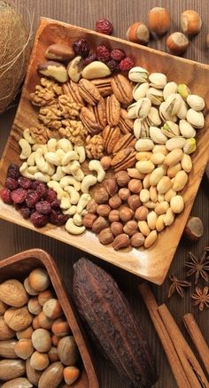 nuts and seeds in wooden bowls on a table