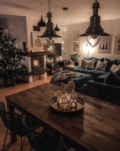 a living room filled with furniture and a christmas tree