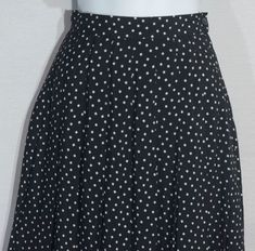 This black and white diamond-shaped polka dot print Petite Sophisticate original and collectible 80s label pleated midi skirt is definitely a wardrobe classic staple. This A-line skirt features accordion / knife pleated tailoring in a smooth rayon material that looks so crisp. It has a tailored high waistband with a button and zipper closure and the hem falls at or just above the knee depending on your fit. This skirt is in really sharp and excellent shape with very subtle signs of wear/use. Che Elegant Fitted Polka Dot Skirt, Polka Dot Pleated Fitted Skirt, Fitted Polka Dot Pleated Skirt, Pleated Short Skirt, 80s Skirt, Knife Pleat, Wardrobe Classic, Pleated Midi Skirt, Diamond Shaped