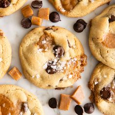 chocolate chip cookies with peanut butter and sea salt are on a white marble countertop