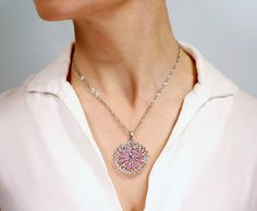 Feel free to contact us to make a custom order inquiry. Lotus Sapphire Pendant crafted in White Gold is a Beautiful Geometrical Pendant, Accented with 12 faceted Pink Sapphire Marquises in a flower-shaped setting, surrounding the central faceted round cut Pink Sapphire. Pink Sapphires are stones of protection, wisdom and prosperity. Pink is the color of new love, new romance and new relationships. It reflects the light of heart and love and activates the heart chakra. It will bring stability in Fine Jewelry Platinum Flower Shaped Jewelry, White Gold Jewelry With Large Flower Pendant, Luxury Necklace With Center Stone As Gift, White Gold Pendant Jewelry With Center Stone, Flower Shaped Halo Setting Jewelry Gift, Rose Gold White Wedding, Gold Infinity Ring, New Romance, Gold Sapphire Ring