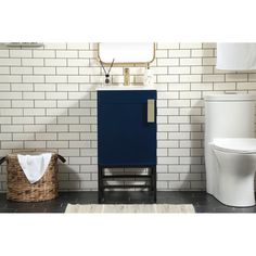 a white toilet sitting next to a blue cabinet on top of a tiled floor in a bathroom