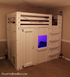 a white loft bed with a blue light in it