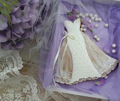 there is a purple box with a wedding dress on it