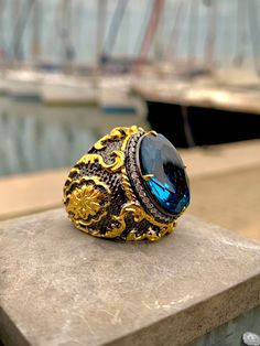 24 K Gold Plated Victorian Ring Ornate Ring Blue Topaz Gemstones Rococo Style Men Ring Handmade Ring Topaz Men  Ring PRODUCT DETAILS * Made to Order * Certified 925 sterling silver * Your ring comes in a pretty ring box ready for gift giving. RING SIZE *It is always safer to see a jeweler to have a more precise idea about your ring size. However, if it is not possible please look at our ring size chart in the pictures. There you can also find the size conversions. *If your ring size is not in th Handmade Luxury Topaz Ring For Anniversary, Luxury Handmade Topaz Ring For Anniversary, Handmade Luxury Topaz Anniversary Ring, Luxury Handmade Topaz Ring, Elegant Topaz Rings With Stones, Topaz Stone Ring Gift, Topaz Rings With Stones For Gift, Handmade Luxury Crystal Ring For Formal Occasions, Topaz Rings With Stones As Gifts