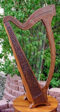 a large wooden harp sitting on top of a table