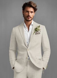 Step up in the sartorial game with our Barn Beige Linen Jacket. Crafted from pure linen, the jacket will carry you through the hot summer days and crisp evenings with grace, poise, and flair. Add a matching waistcoat, a white shirt, and black shoes for a stylish outfit. 
 
Look Includes   Barn Beige Linen Fabric  Two Button Jacket Style  Notch Lapel  Corozo Beige Buttons  Single Vent  Three Cuff Buttons   You can change the look during customization if required. 
 
Lining: Viscose; Dry Clean. Beige Linen Suit, Linen Wedding Suit, Mens Beach Wedding Attire, Blazer Outfits Men, Beach Wedding Attire, Groomsmen Suits, Wedding Linens, Linen Suit, Summer Linen