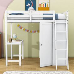 there is a white bunk bed with a ladder on the bottom and a desk underneath it