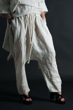 Linen Harem Pants, Wide linen pants, Natural Linen Pants. Harem Linen Pants with elastic waist and tie rope. SIZE & FIT: *Our Model is 5′6″ / 175 cm and wears size M. *Available Sizes: form XS up to 8XL *This product could be customized according to your measurements. *Please leave your requirements in the checkout. CARE Dry Cleaning Machine Wash 30oC Hand Wash with warm water Medium hot iron Time to ship & DELIVERY : Your piece will be ready to ship in 5-6 biz days upon placing your ord White Drawstring Bottoms Loosely Fitted Hips, White Bottoms With Drawstring And Loosely Fitted Hips, Straight Harem Pants With Drawstring, Loosely Fitted Harem Pants With Drawstring, Loosely Fitted Straight Harem Pants With Drawstring, Baggy Tapered Leg Pants With Drawstring, Bohemian White Drawstring Bottoms, White Bohemian Bottoms With Drawstring, Cotton Pants With Tie Waist And Tapered Leg