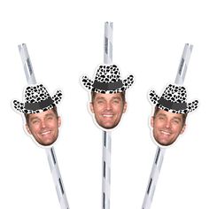 three stickers with the faces of two men wearing hats and holding sticks in their hands