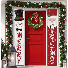 a red door decorated with christmas decorations and wreaths