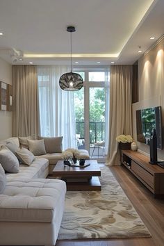 a living room filled with furniture and a flat screen tv