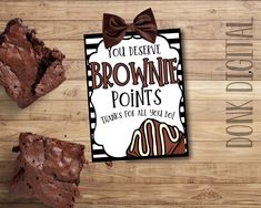 two brownies are next to each other on a wooden table with the words you decide brownie points