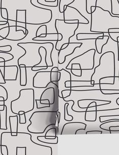 an abstract drawing with lines and shapes on the wall next to a white sheet that has been drawn onto it