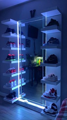 an illuminated shoe rack in the corner of a room