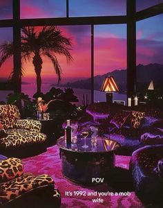 a living room filled with lots of purple furniture