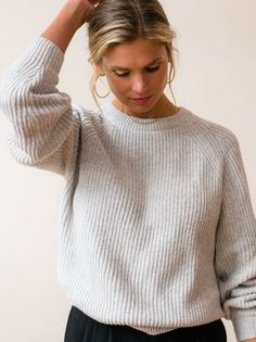 Keep it cozy in this season-spanning, uber-soft, essential sweater. Featuring allover rib detailing with a relaxed fit, this classic knit is made with a sustainable cotton blend. The Rowan’s versatile design looks great paired with a skirt or with your favorite denim for a laid back vibe. 55% BCI Cotton, 25% Recycled Polyester, 20% Recycled Nylon BCI Cotton – The Better Cotton Initiative supports more environmentally, socially, and economically sustainable farming practices. Crew neckline Raglan Relaxed Fit Sweater With Ribbed Crew Neck, Relaxed Fit Crew Sweater With Ribbed Neckline, Affordable Ribbed Relaxed Fit Sweater, Relaxed Fit Heather Grey Crew Neck Sweater, Relaxed Fit Ribbed Cashmere Sweater, Casual Airport Outfit, Trim Detail, Ribbed Sweater, Airport Outfit