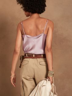 An indulgent, elegant essential, this versatile camisole is crafted from our washable silk charmeuse and cut on the bias for figure-flattering drape.  SEMI-FITTED: Cut for a not-too-tight, not-too-loose fit.  V-neck.  Adjustable slider straps.  Dolphin hem.  Unlined.  Semi-fitted.  Sleeveless.  Hip length.  Front bodice length (size S): Petite 17. 75", Regular 18. 5", Tall 20. 5" Model: Size S or XL, 5'10" (178cm).  Machine wash cold, gentle cycle, line dry. Feminine Silk Camisole With Built-in Bra, Silk Cami Tank Top With Built-in Bra, Chic Silk Sleeveless Camisole, Chic Sleeveless Silk Camisole, Feminine Silk Camisole With Adjustable Straps, Silk Camisole With Built-in Bra, Feminine Silk Camisole With Spaghetti Straps, Chic Silk Camisole Top, Feminine Silk Cami Tank Top