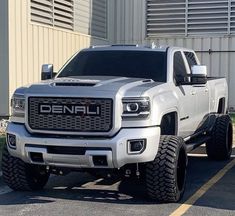 a white truck parked in front of a building