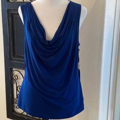 Calvin Klein Size Large Royal Blue Sleeveless Top With A Draped Neck Front. New With Tags And Pairs With Skirt And Jacket. Blue Stretch Sleeveless Vest, Blue Stretch Tank Vest, Blue Sleeveless Vest Top, Chic Blue Stretch Tank Top, Blue Tank Vest For Spring, Blue Sleeveless Blouse For Night Out, Chic Blue Tank Vest, Elegant Blue Sleeveless Blouse, Elegant Blue Tank Top For Spring